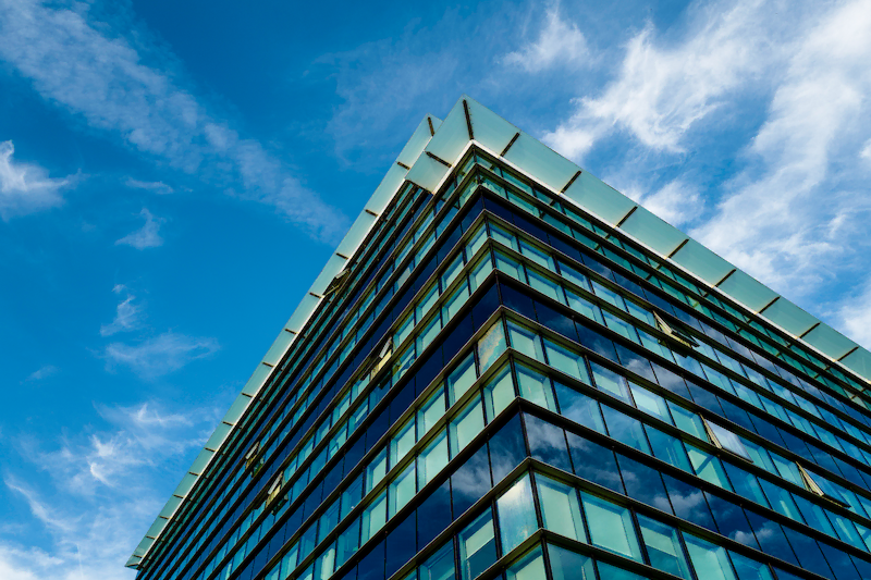 View of building from below with blue skys.