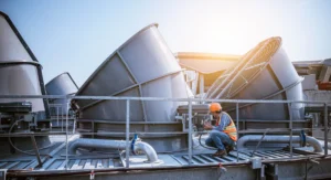 Engineer working on a rooftop HVAC system