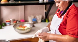 Woman chef putting on gloves